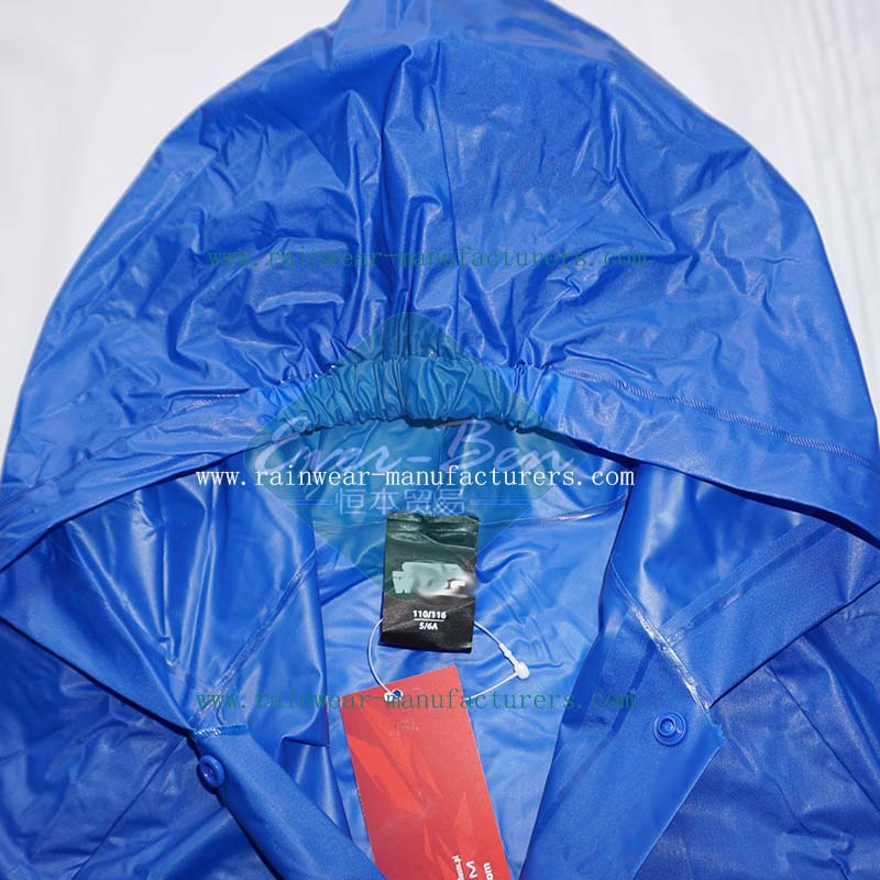 Blue plastic hooded rain mac elastic hood